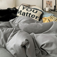 Housse de couette réversible en coton gris uni, revers bleu